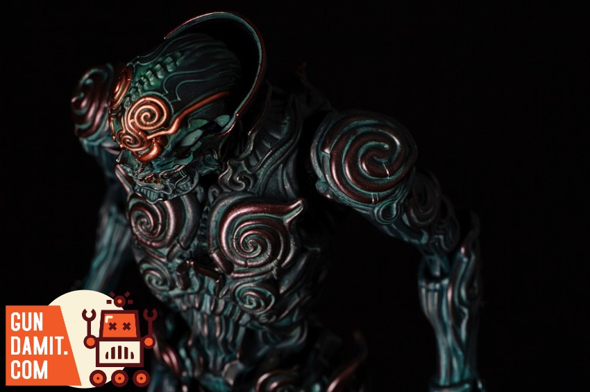 Sentinel Toys 1000toys Takayuki Takeya Jomon Puppet Black Bo Dark, intricately designed figurine with swirling patterns and a Sentinel Toys 1000toys Takayuki Takeya Jomon Puppet Black Bo Dark, intricately designed figurine with swirling patterns and a