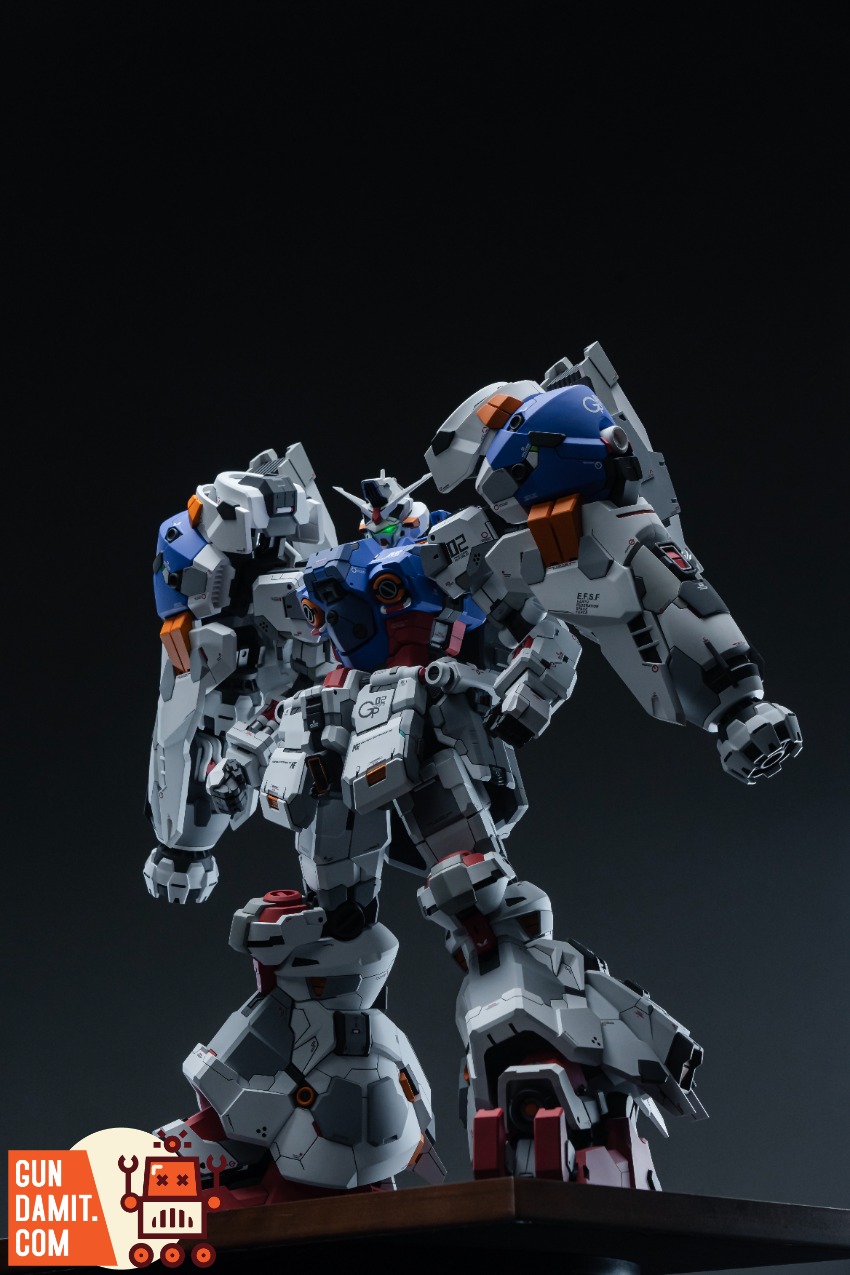XXtoys Studio 1/48 Physalis Standard Version A highly detailed Gundam model stands in a dynamic pose against a dark backgroun XXtoys Studio 1/48 Physalis Standard Version A highly detailed Gundam model stands in a dynamic pose against a dark backgroun