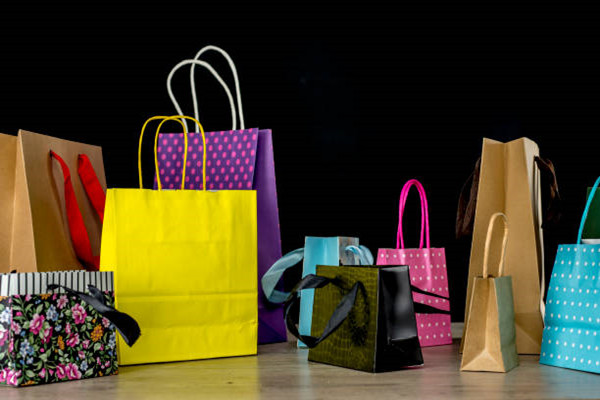 Colorful paper bags with handles give your customers privacy