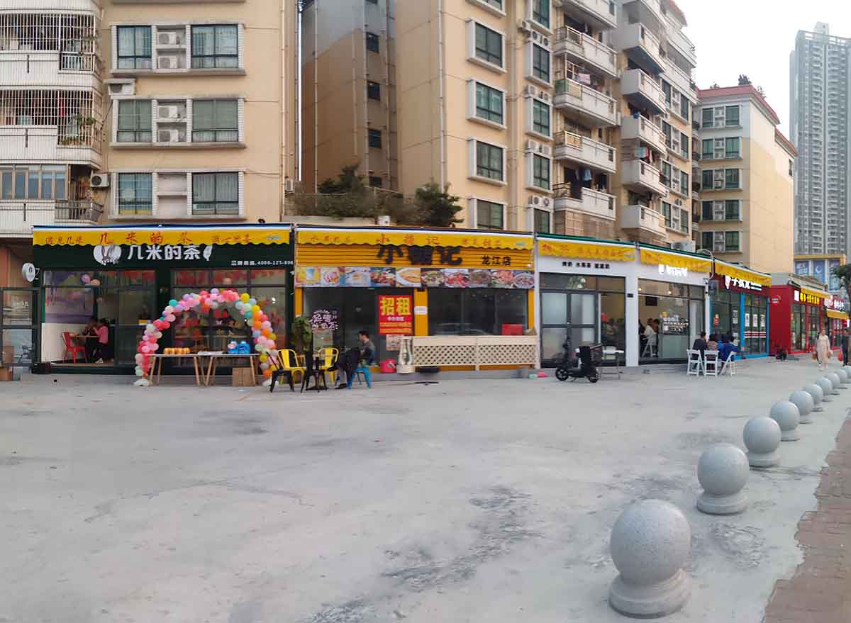 an image of container houses street