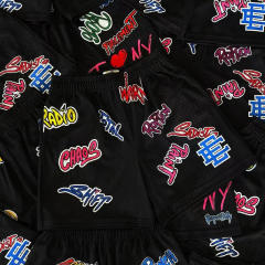 EE Eric Graffiti Letter Print Mesh Shorts