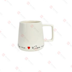 PORCELAIN ANGLED SHAPE MUG W/ RAISED WORDS
& HEART DECAL