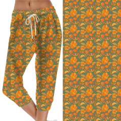 Small yellow flowers on green background capri jogger