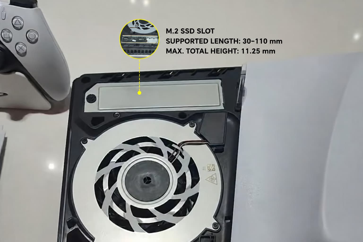 Diagram showing the M.2 SSD slot beneath the PS5 side cover and supported installation dimensions