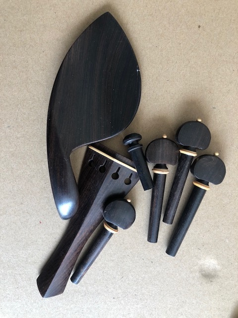 1 set of 4/4 size  violin fittings ebony wood made hand carved completely including chin rest , tailpiece , 4 pegs and endpin