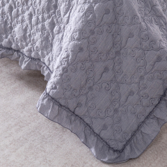 Elegant Embroidered Quilt with Ruffle Edge