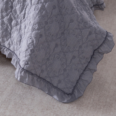 Elegant Embroidered Quilt with Ruffle Edge