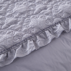 Elegant Embroidered Quilt with Ruffle Edge