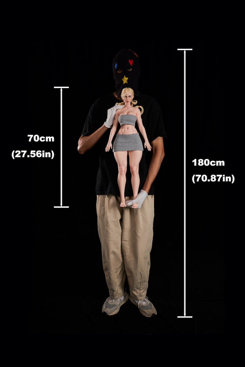 Scale comparison: A 180cm tall man holding the CLM Si70 KA Freya 70cm silicone sex doll to show its size. A lightweight mini silicone sex doll and highly portable compact anime doll.