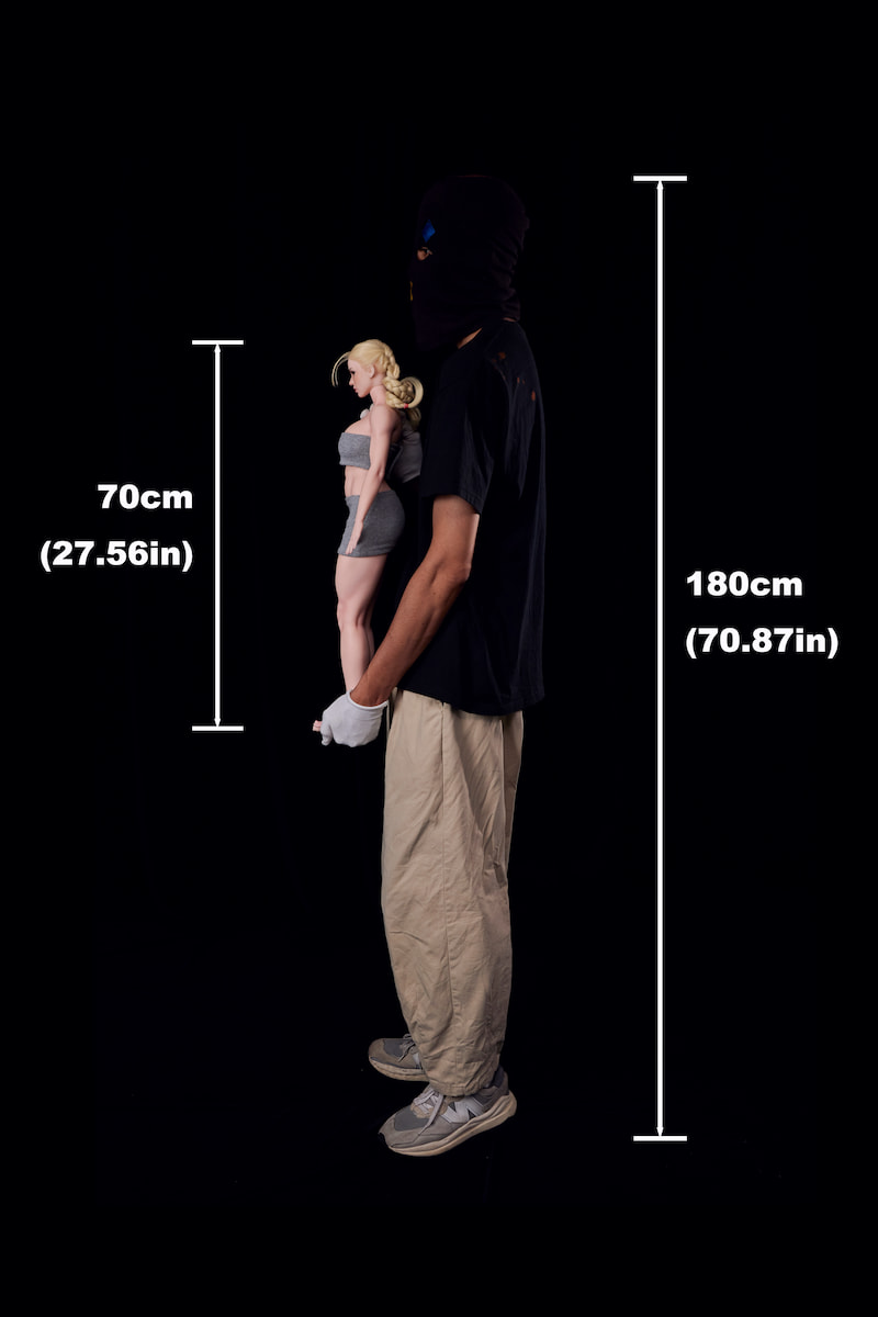 Side view comparison: A 180cm man holding the CLM Si70 KA Freya 70cm silicone sex doll. This lightweight mini silicone sex doll showcases a slender, compact anime doll profile.