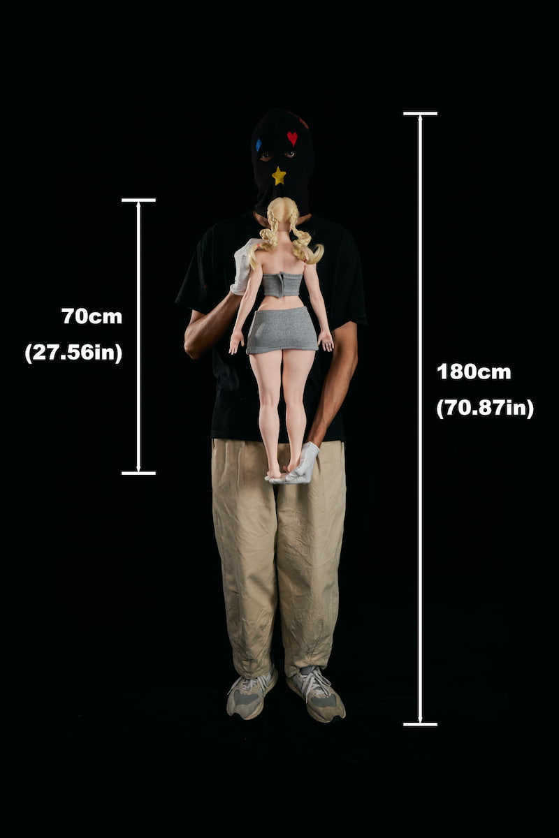 Rear view scale: A 180cm man holding the CLM Si70 KA Freya 70cm silicone sex doll to show its back curves. A lightweight mini silicone sex doll and easy-to-carry compact anime doll.