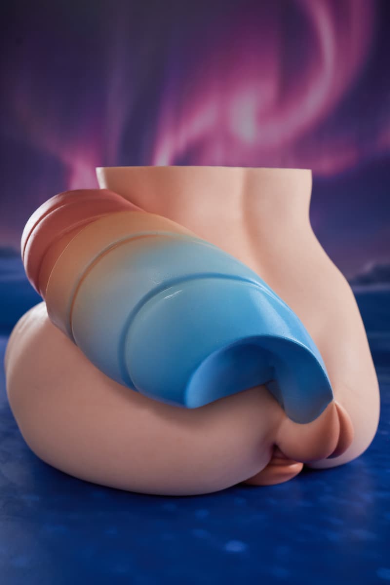 PA-Ray: This rear-quarter view showcases the product's full, rounded double-hip profile, prominently highlighting the pink-to-blue gradient layered tail draped from the top, along with partial private area details below.