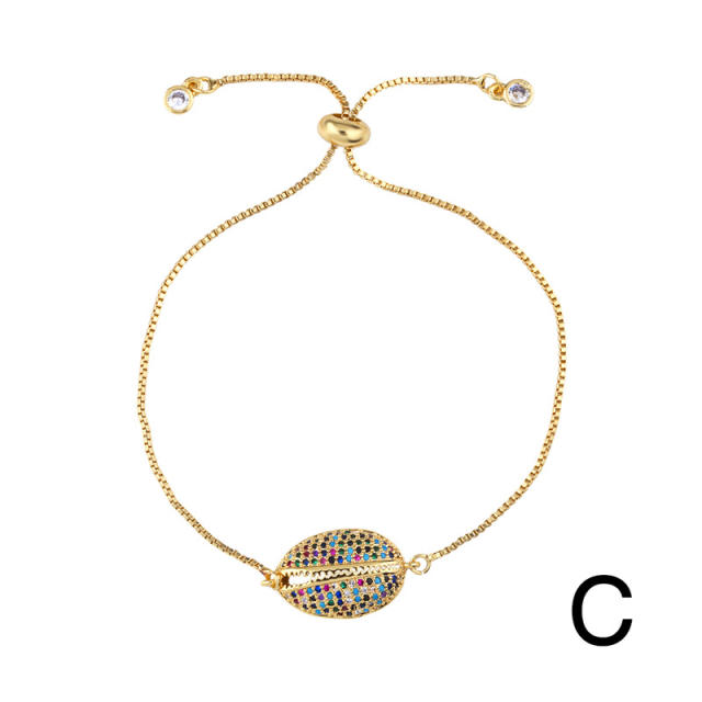 Rainbow cubic zircon cross and shell bracelet