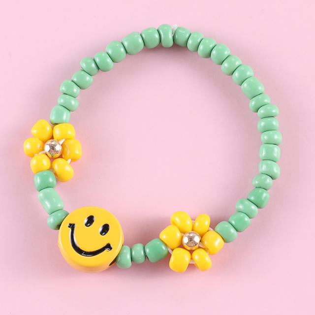 Green color seed beads smile face bracelet