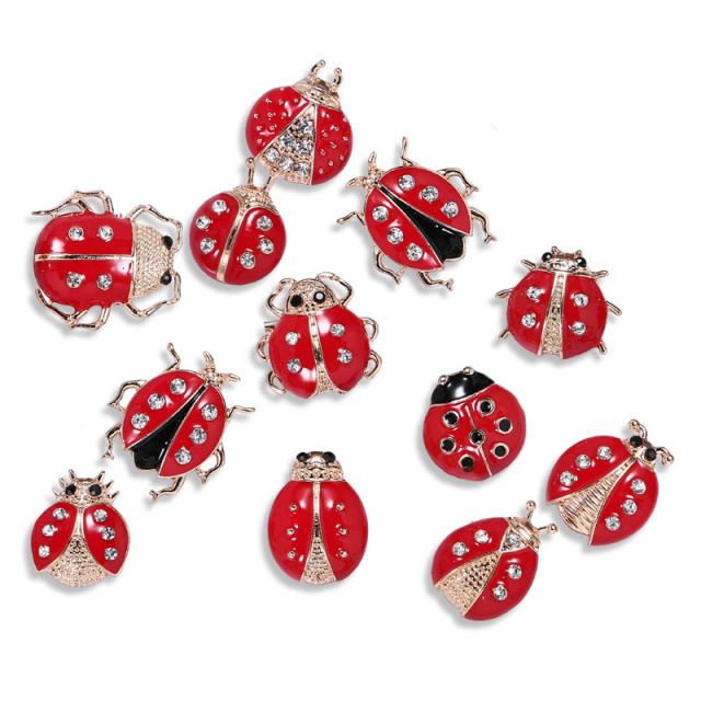 Cartoon beetles brooch