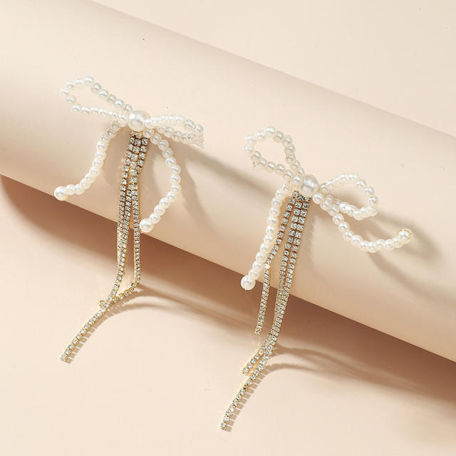 Pearl bow rhinestone tassel earrings