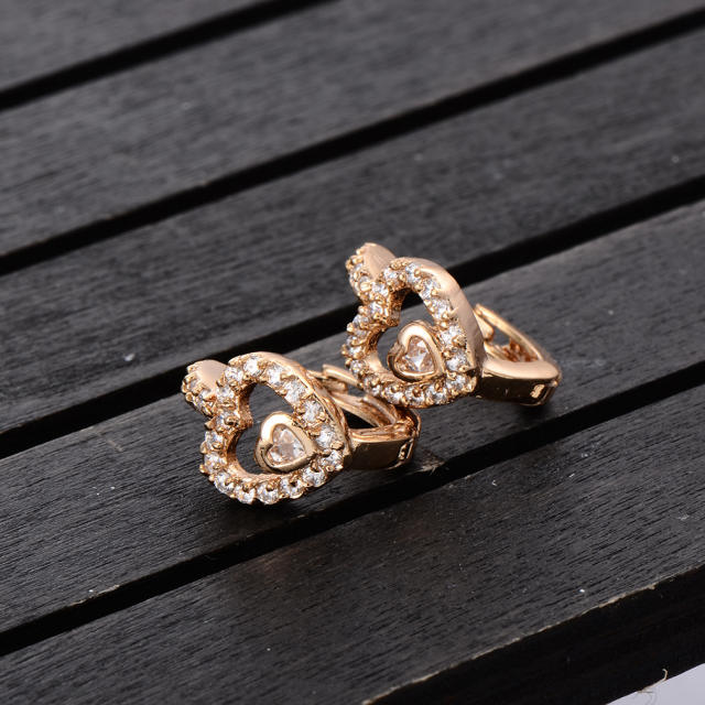 Fashion hollowed out heart cubic zirconia huggie earrings