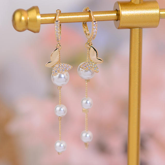 Diamond butterfly pearl tassel huggie earrings