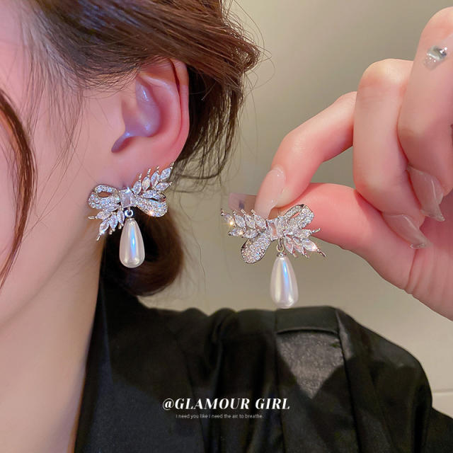 Crystal bow pearl drop earrings