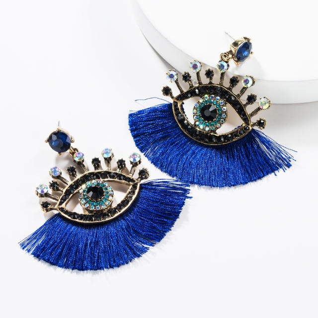 Evil's eye tassel earrings