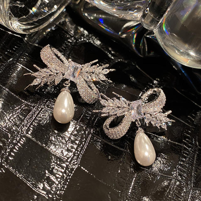 Elegant diamond bow pearl drop earrings