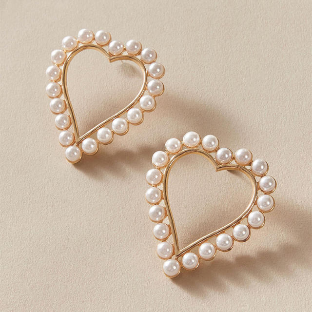 Korean fashion OL hollow heart pearl ear studs