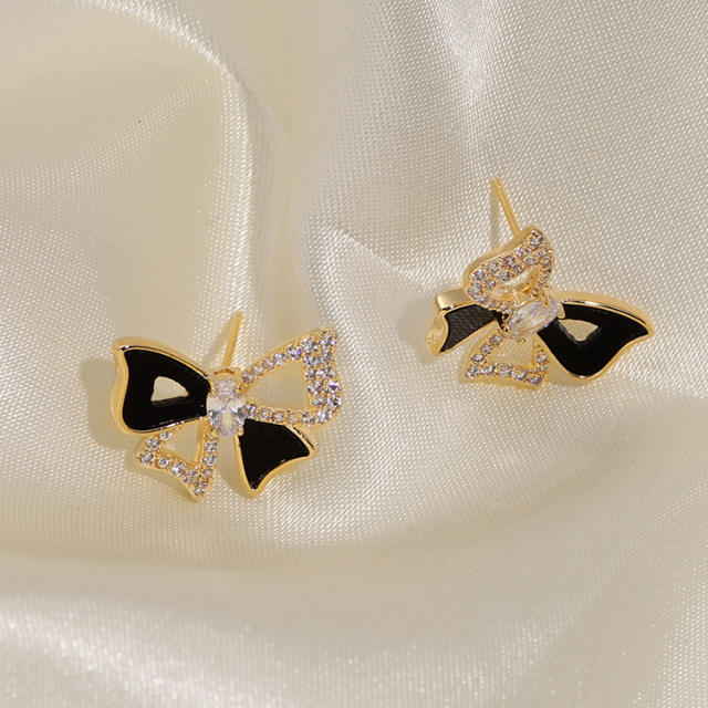 Diamond bow hollow out clip on earrings