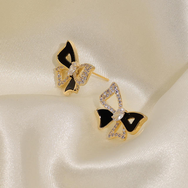 Diamond bow hollow out clip on earrings