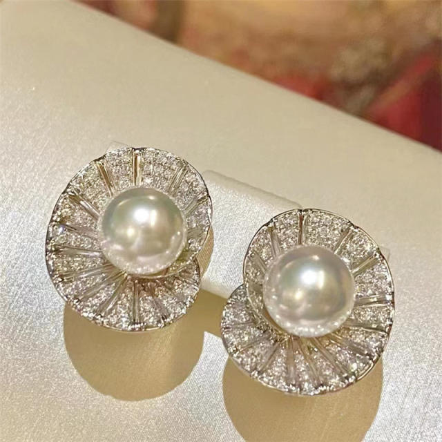 Elegant diamond shell shape pearl studs earrings