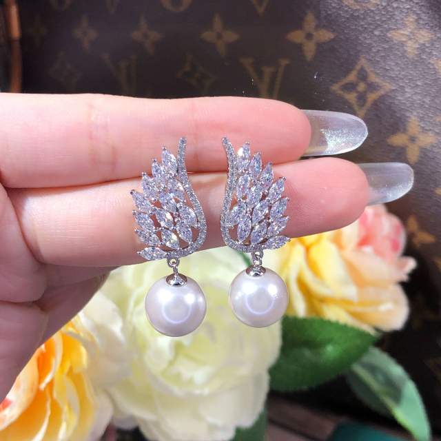 Pearl drop angel wing diamond earrings