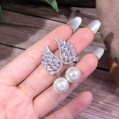 Pearl drop angel wing diamond earrings