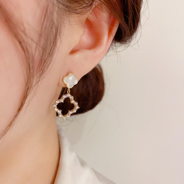 Fashionable white shell clover hollow earrings