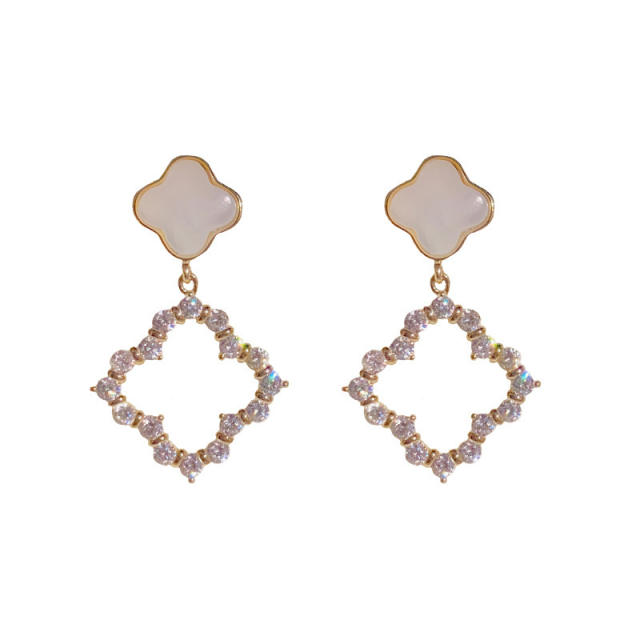 Fashionable white shell clover hollow earrings