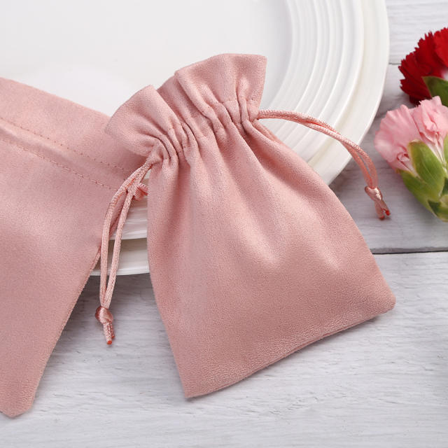 Pink color suede string jewelry bag