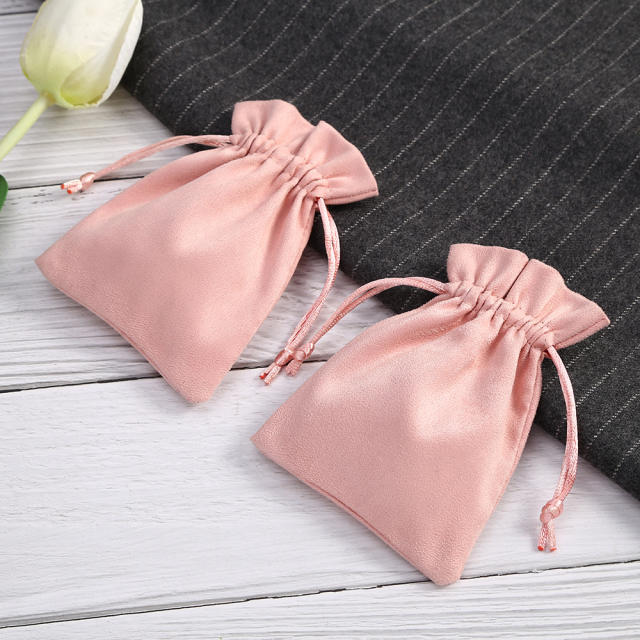 Pink color suede string jewelry bag