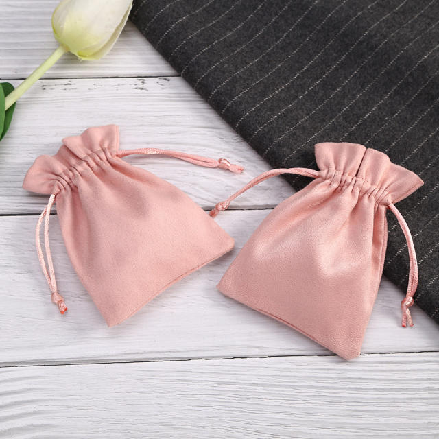 Pink color suede string jewelry bag