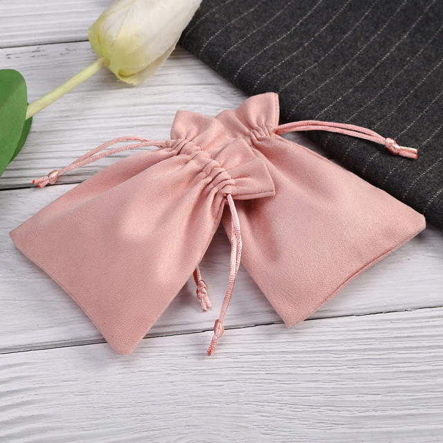 Pink color suede string jewelry bag