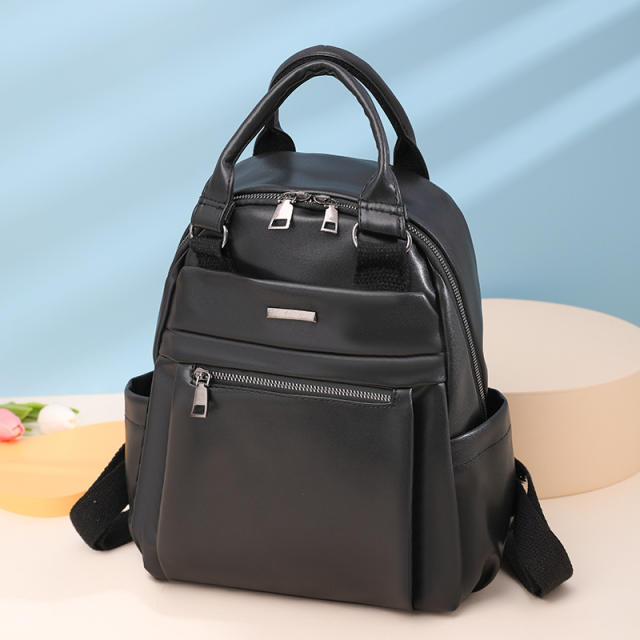 Plain color PU material soft backpack with handle