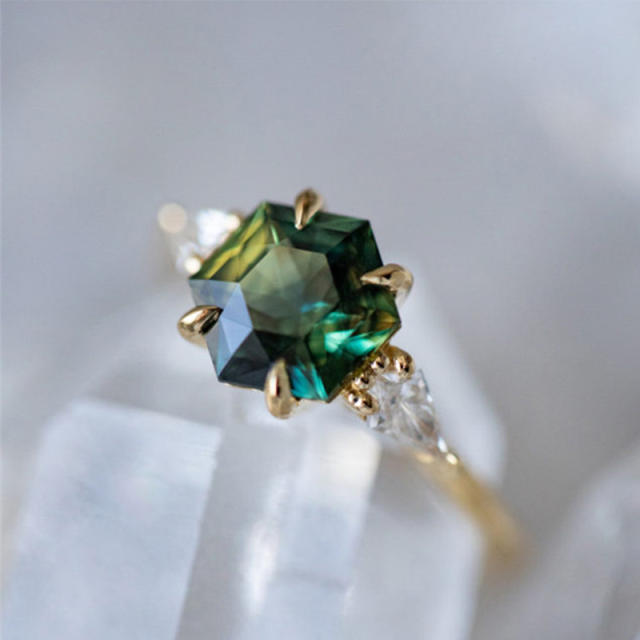 Elegant gold color emerald statement halo rings