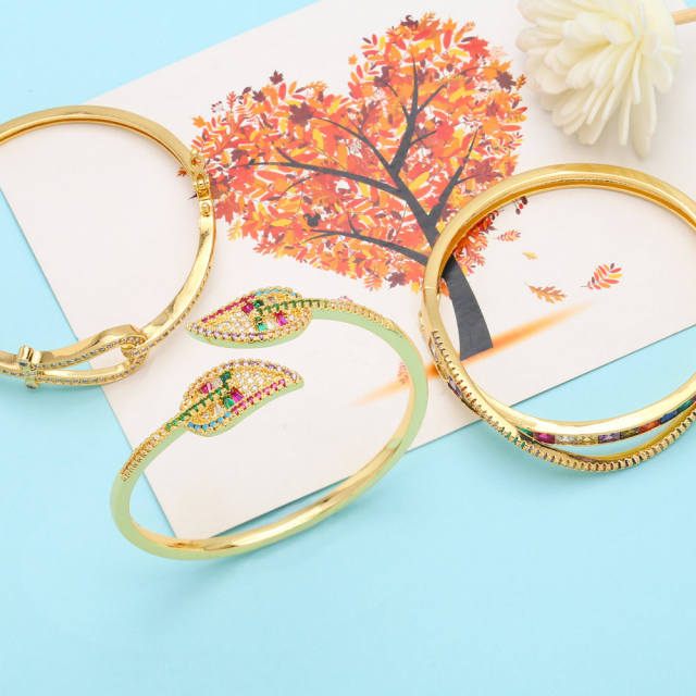 Delicate rainbow cz statement gold plated copper bangle