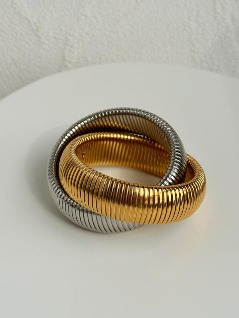 Chunky 18K gold twisted design elastic stainless steel bangle