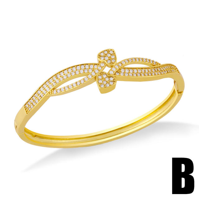 Delicate diamond flower twisted gold plated copper bangle bracelet