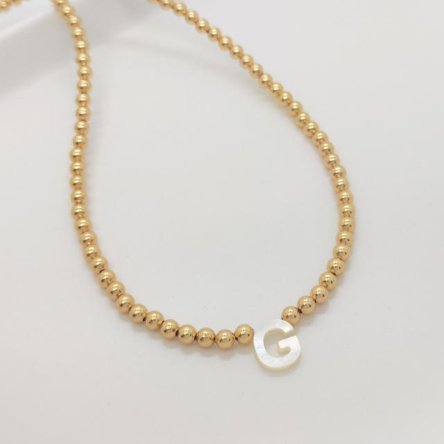 Natural shell initial letter gold plated copper beaded necklace