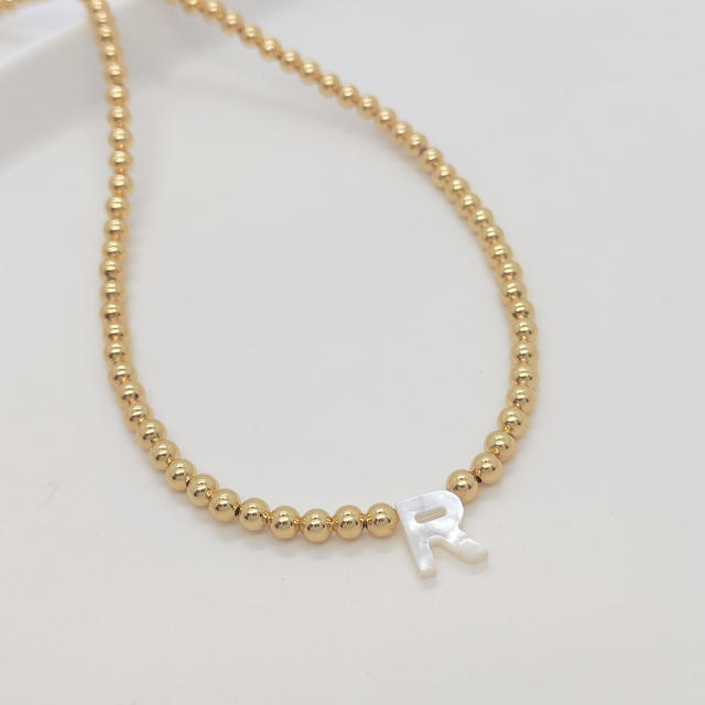 Natural shell initial letter gold plated copper beaded necklace