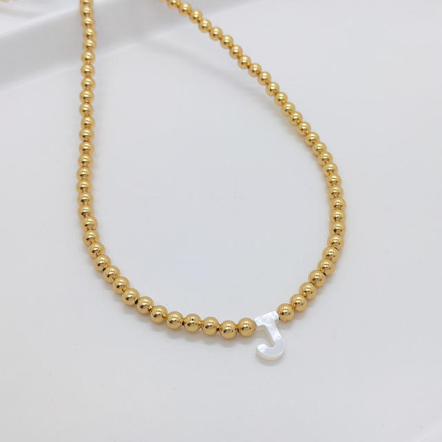 Natural shell initial letter gold plated copper beaded necklace