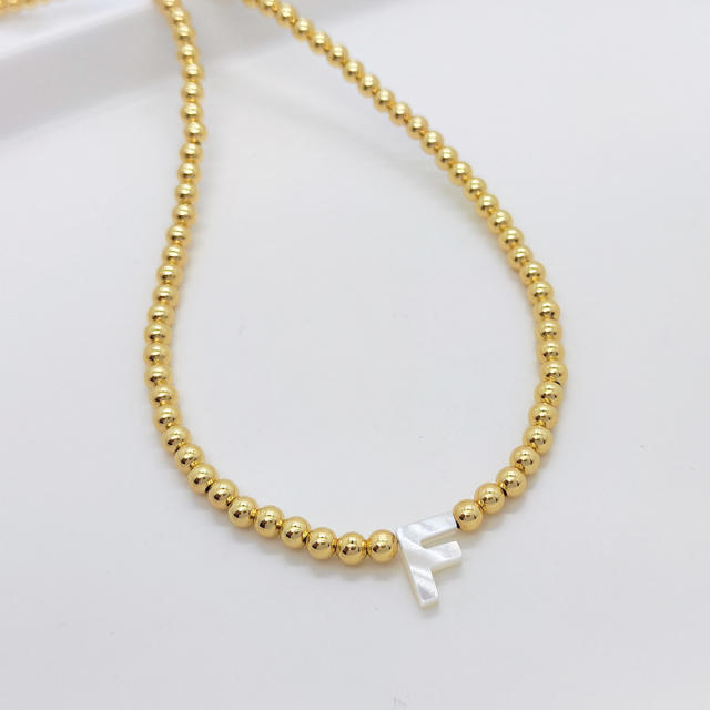 Natural shell initial letter gold plated copper beaded necklace