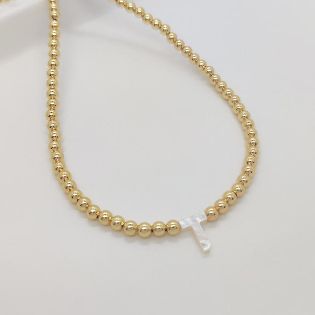 Natural shell initial letter gold plated copper beaded necklace