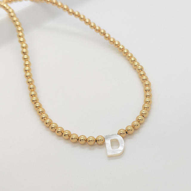 Natural shell initial letter gold plated copper beaded necklace