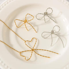 18KG hot sale hollow out bow stainless steel necklace earrings set