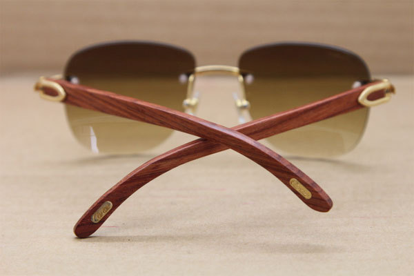 Cartier Rimless T8300680 Original Wood Sunglasses in Gold Brown Lens